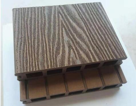 Embossed composite decking board